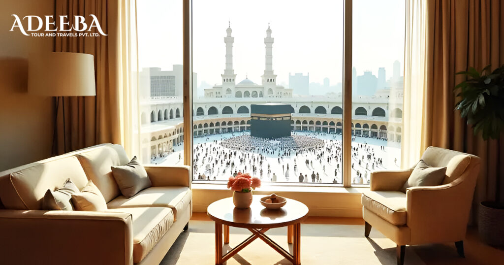 View of the Kaaba through a large window, highlighting the elegance of a luxury Umrah package experience.