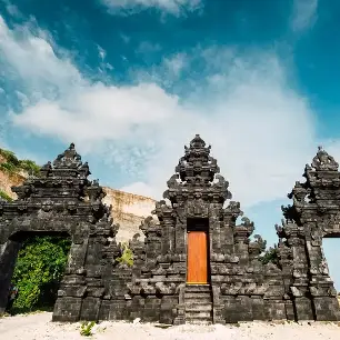 Experience the unique architecture of Bali with this image of a traditional Hindu temple gate, showcasing intricate details and cultural heritage.