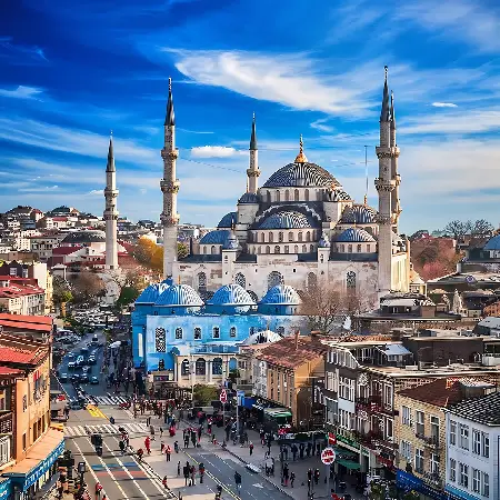 The iconic Blue Mosque in Istanbul, Turkey, under a bright blue sky, featured in our premium international tour packages.