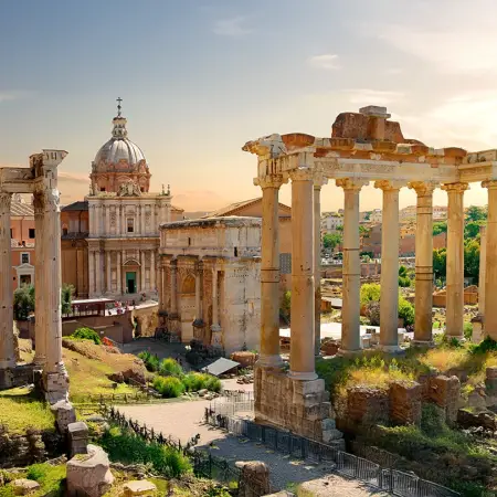 Roman Forum with the Temple of Vespasian, a highlight of international tour packages in Italy's rich history.