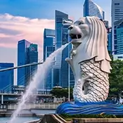 The iconic Merlion statue spouting water against the backdrop of the city skyline, a must-visit landmark.