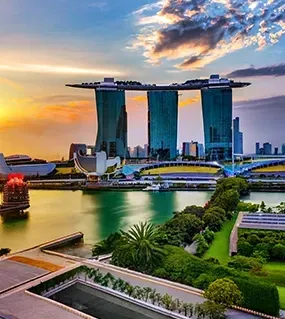 The breathtaking HSBC Rain Vortex at Jewel Changi Airport surrounded by lush greenery, a top destination featured in Singapore Package.