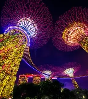 The breathtaking HSBC Rain Vortex at Jewel Changi Airport surrounded by lush greenery, a top destination featured in Singapore Package.
