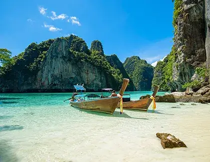 Long-tail boat on a beautiful tropical beach in Thailand.