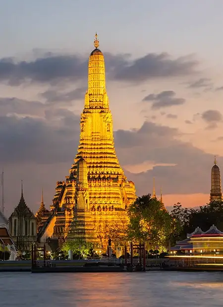 Dynamic Bangkok skyline showing ancient golden temples and modern high-rise buildings.