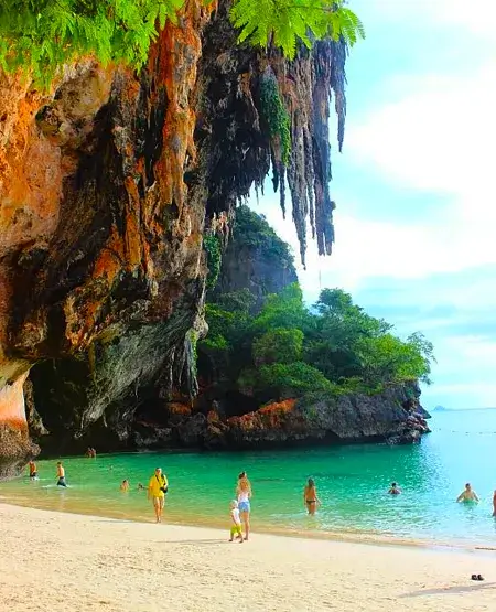 Dramatic limestone cliffs towering over Railay Beach, Krabi, a popular rock climbing spot.