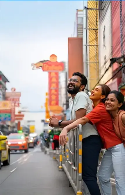 Friends enjoying Bangkok street nightlife during a Thailand tour package from India with vibrant city views and local market experience.