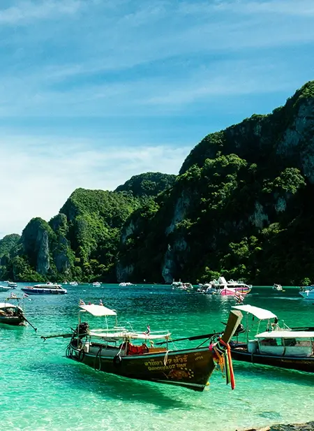 Krabi dramatic limestone cliffs, emerald water, and long-tail boat tours.
