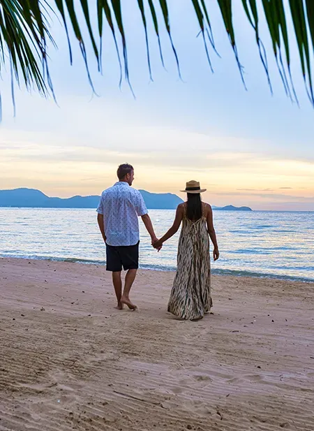 Ko Samui lush beach with coconut groves, ideal for a serene couple's getaway.