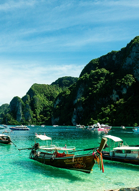 Krabi dramatic limestone cliffs, emerald water, and long-tail boat tours.