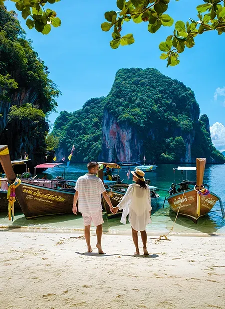 Krabi dramatic limestone cliffs, emerald water, and long-tail boat tours.