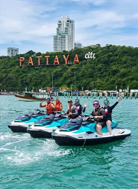 Pattaya coast with water sports activities and vibrant tourist entertainment.
